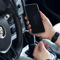 The Leef USB-C charging cable getting inserted into a Samsung Galaxy S8 to charge while in a car